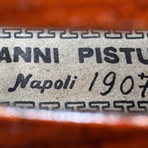 An old violin, labeled Giovanni Pistucci Napoli 1907.